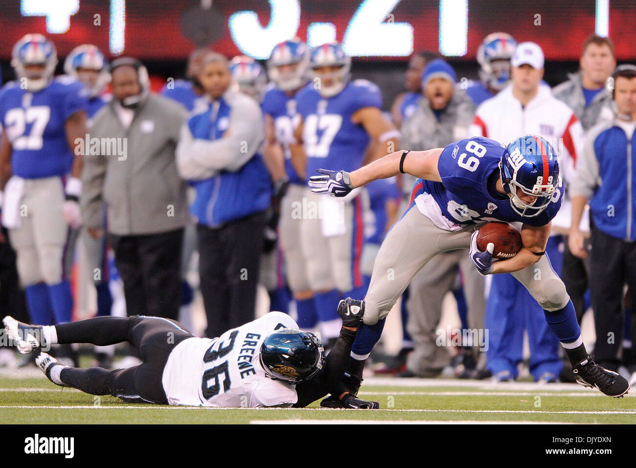 New York Giants tight end Kevin Boss (89) steps out of Jacksonville Jaguars  safety Courtney Greene's (36) tackle to score the game-winning touchdown  during second half week 12 NFL action between the