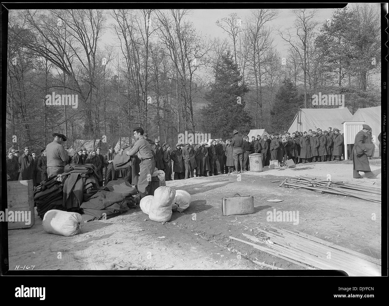 Another view of the issuing of equipment to the new arrivals at CCC Camp, TVA 5E23, between Walker's Ford and Lone... 532785 Stock Photo