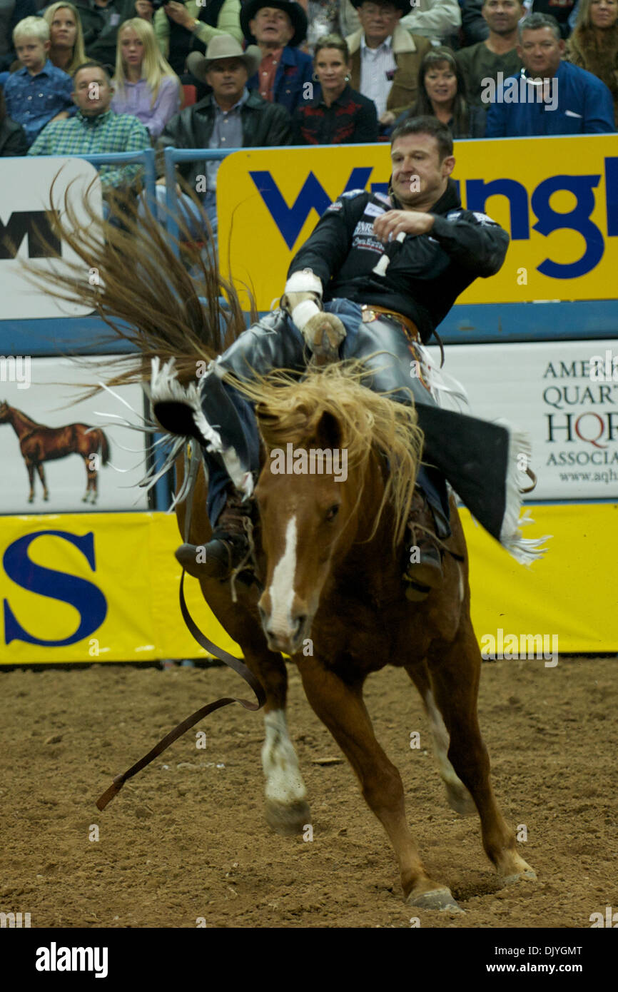 Dec. 2, 2010 - Las Vegas, Nevada, United States of America - Bareback rider Clint Cannon of Waller, TX rides Wild Flower for a score of 79.50 during the first go-round at the 2010 Wrangler National Finals Rodeo at the Thomas & Mack Center. (Credit Image: © Matt Cohen/Southcreek Global/ZUMAPRESS.com) Stock Photo