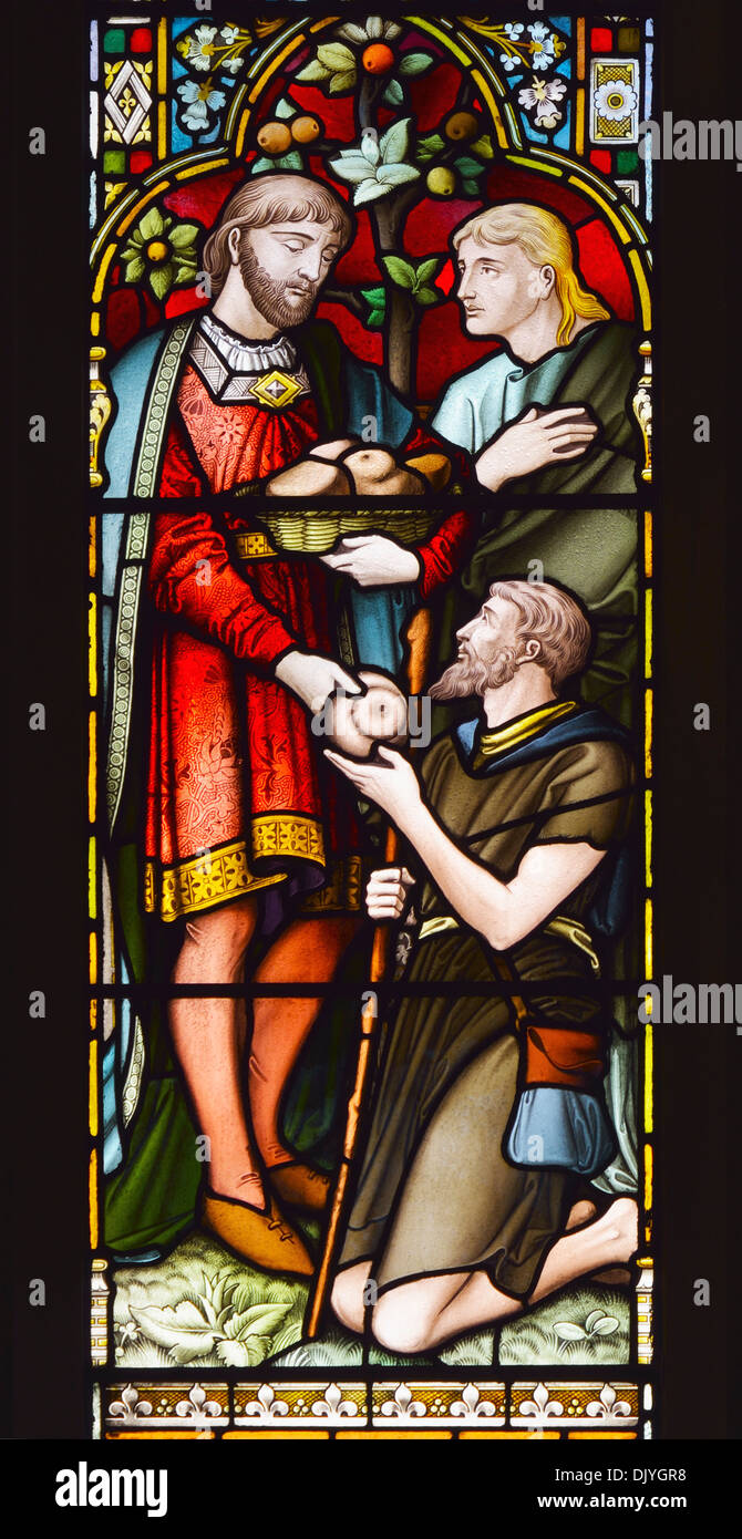 Giving to the needy. Detail of South aisle East window. Church of Saint Paul, Grange-over-Sands, Cumbria, England, U.K., Europe. Stock Photo