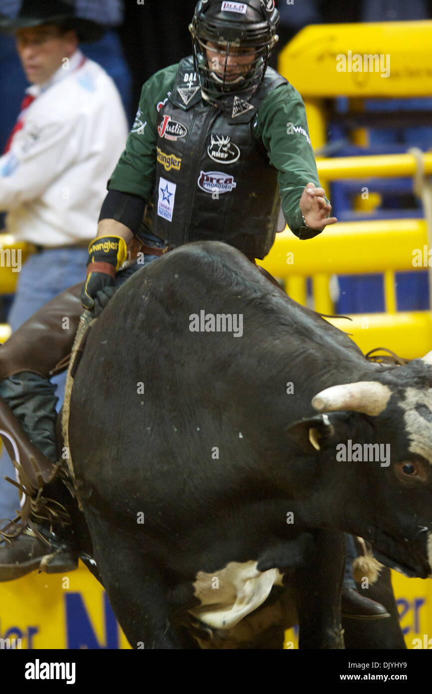 Dec. 3, 2010 - Las Vegas, Nevada, United States of America - Bull rider Dustin Elliott of North Platte, NE rides Diamond Joe for no score during the second go-round at the 2010 Wrangler National Finals Rodeo at the Thomas & Mack Center. (Credit Image: © Matt Cohen/Southcreek Global/ZUMAPRESS.com) Stock Photo