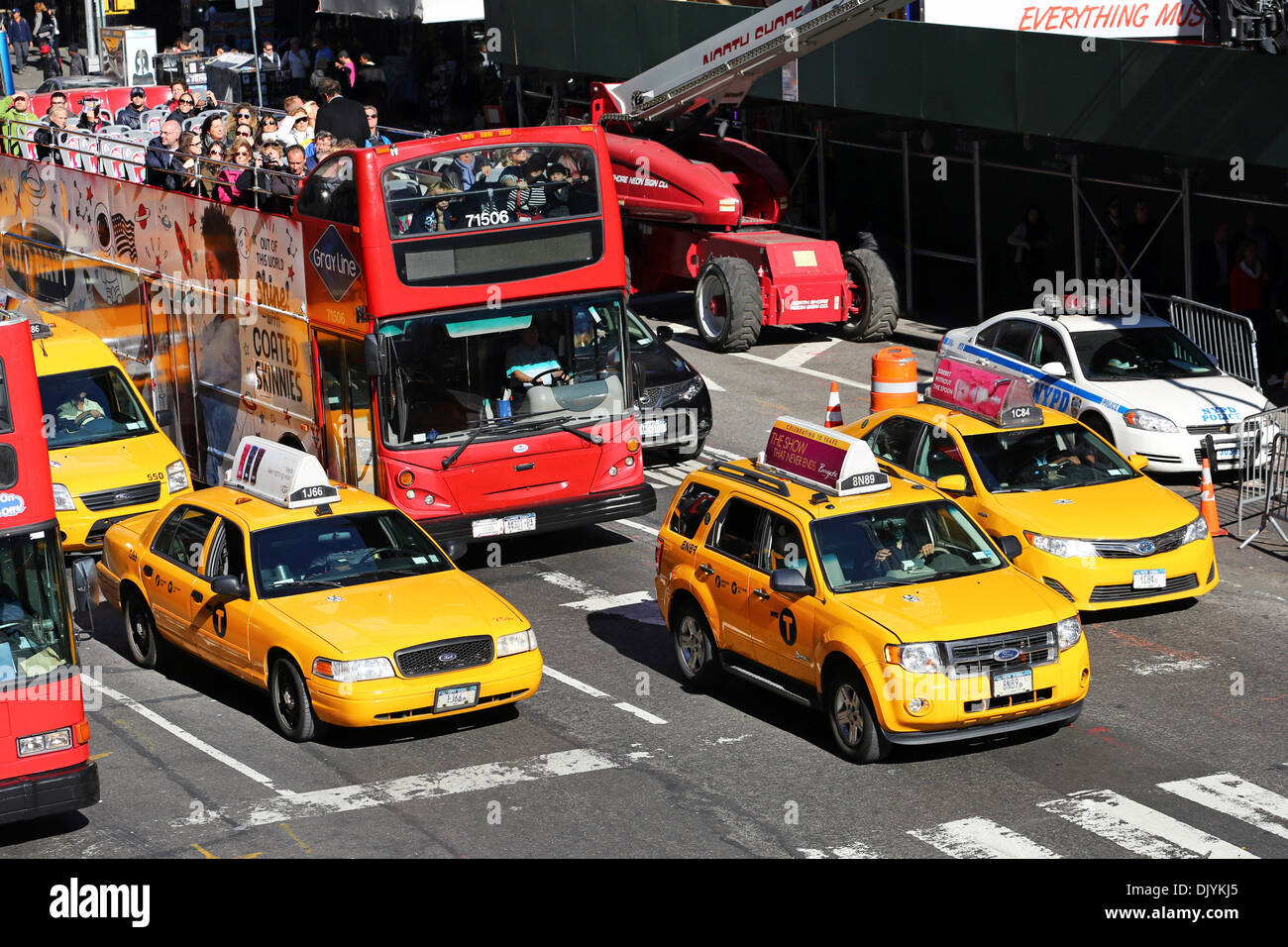 Yellow taxi cabs driving in the street, New York. America Stock Photo