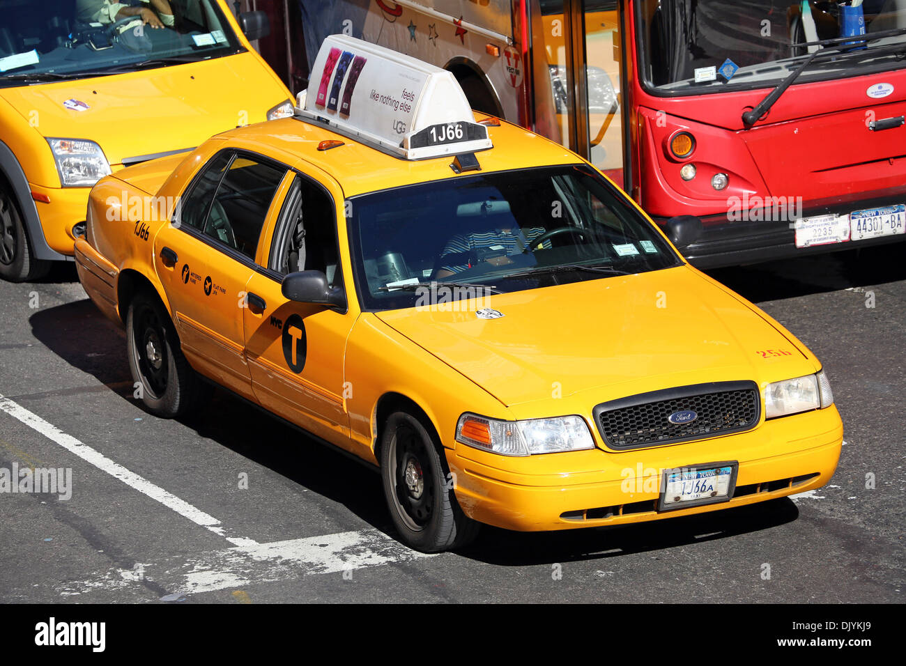 Yellow taxi cabs driving in the street, New York. America Stock Photo