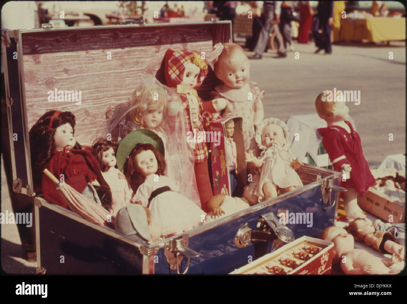 ASSORTMENT OF DOLLS AT A FLEA MARKET IN WHITE CLOUD, KANSAS NEAR TROY. IT IS SPONSORED BY THE MA