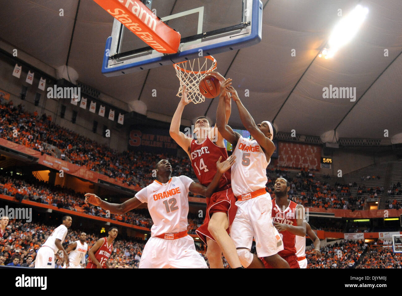 Dec. 4, 2010 - Syracuse, New York, United States of America - North Carolina State Wolfpack center Jordan Vandenberg (14) pulls down the offensive rebound away from Syracuse Orange forward C.J. Fair (5) late in the first half. Syracuse leads North Carolina State 38-34 at the half at the Carrier Dome in Syracuse, New York. (Credit Image: © Michael Johnson/Southcreek Global/ZUMAPRESS Stock Photo