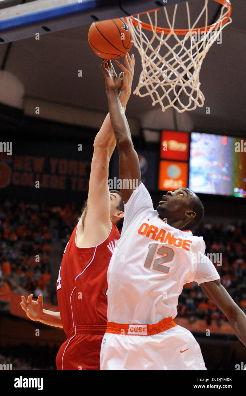 Dec. 4, 2010 - Syracuse, New York, United States of America - Syracuse Orange forward Baye Moussa Keita (12) gets a hand on the ball while battling North Carolina State Wolfpack center Jordan Vandenberg (14) for the first half rebound. Syracuse leads North Carolina State 38-34 at the half at the Carrier Dome in Syracuse, New York. (Credit Image: © Michael Johnson/Southcreek Global/ Stock Photo