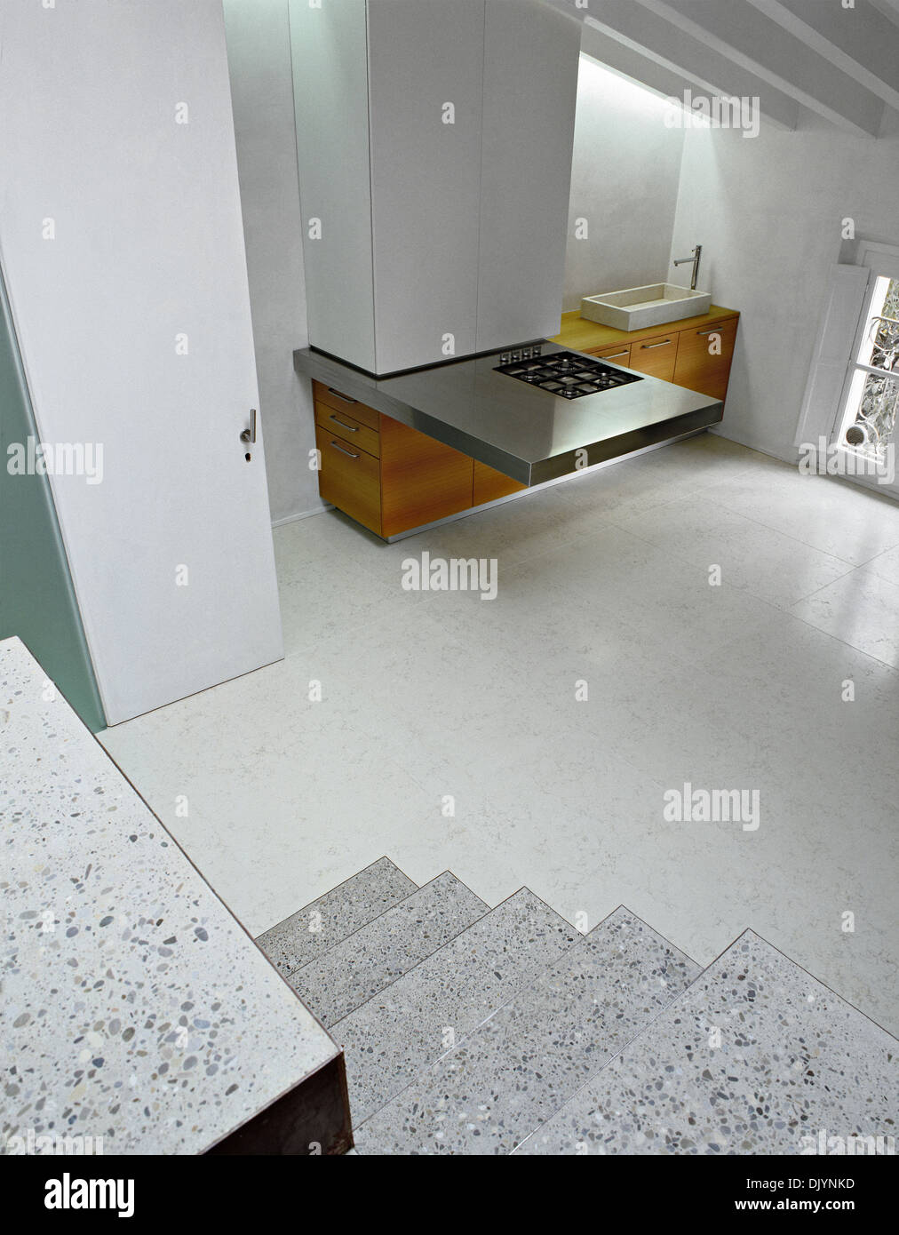 modern kitchen with steel worktop in the modern kitchen in the attic