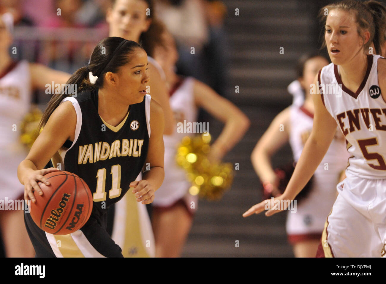 Dec. 5, 2010 - Denver, Colorado, United States of America - Vanderbilt's Jasmine Lister (11) dribbles as Denver's Britteni Rice (5) defends. The Denver Pioneers lead the #23 Vanderbilt Commodores by a score of 29-28 at the half at Magness Arena. (Credit Image: © Andrew Fielding/Southcreek Global/ZUMAPRESS.com) Stock Photo