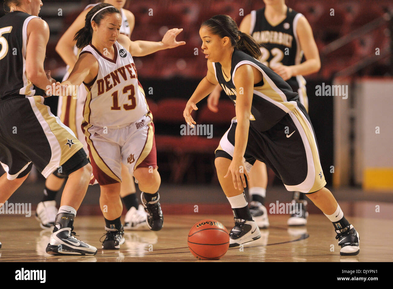 Dec. 5, 2010 - Denver, Colorado, United States of America - Vanderbilt's Jasmine Lister (11) drives with the ball on Denver's Emiko Smith (13). The Denver Pioneers knocked off the #23 Vanderbilt Commodores by a score of 70-65  at the half at Magness Arena. (Credit Image: © Andrew Fielding/Southcreek Global/ZUMAPRESS.com) Stock Photo