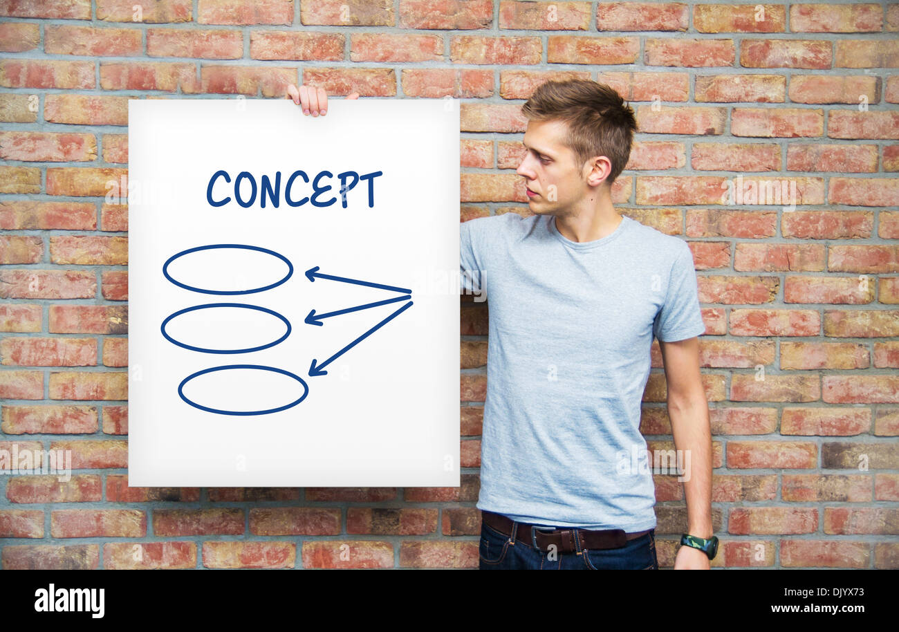 Young man holding whiteboard with diagram Stock Photo