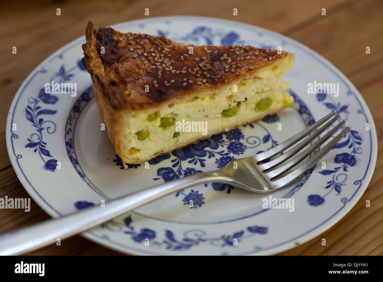 A slice of traditional Gozitan cheese pie whose main ingredients are soft sheep's cheese and dried grated sheep's cheese. Stock Photo