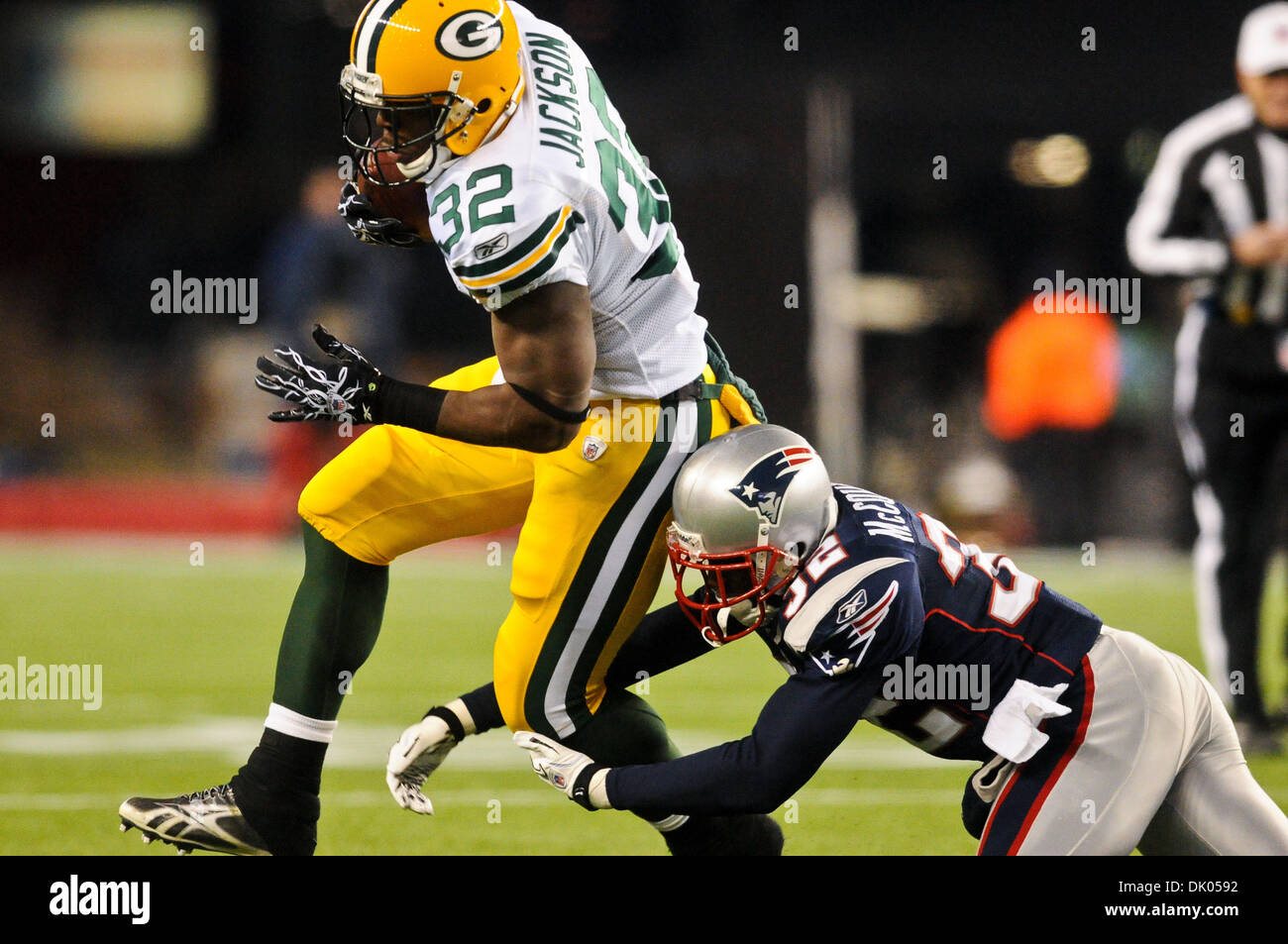 Dec. 19, 2010 - Foxborough, Massachusetts, United States of America - Packers RB Brandon Jackson (32) is tackled by New England Patriots' CB Devin McCourty (32). At the half the Green Bay Packers leads the New England Patriots 17 - 14 at Gillette Stadium. (Credit Image: © Geoff Bolte/Southcreek Global/ZUMAPRESS.com) Stock Photo