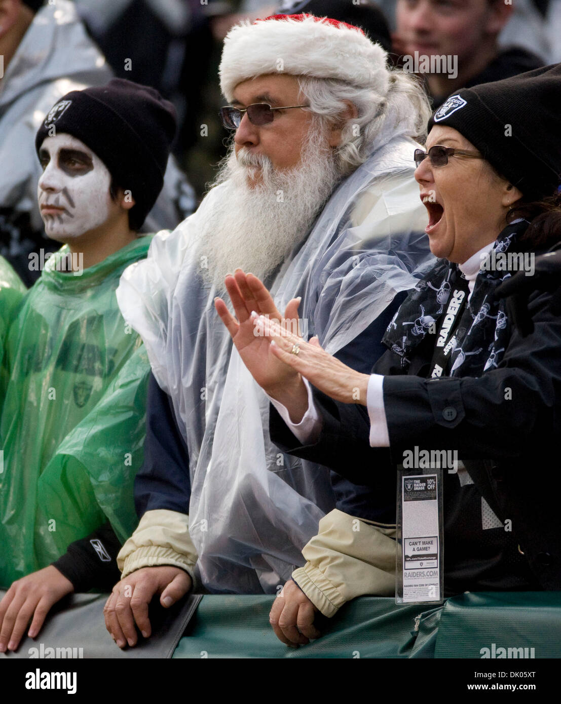 An Oakland Raiders fan is dressed like Santa Claus during the