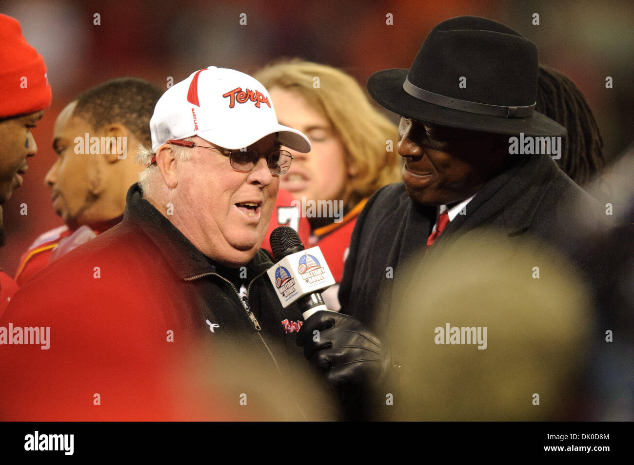 Dec. 29, 2010 - Washington, DC, U.S - Outgoing Head Coach of Maryland Ralph Friedgen talks with Doc Walker after receiving the trophy after the 2010 Military Bowl at RFK Stadium in Washington. DC. Maryland defeated East Carolina 51-20. (Credit Image: © Rassi Borneo/Southcreek Global/ZUMAPRESS.com) Stock Photo