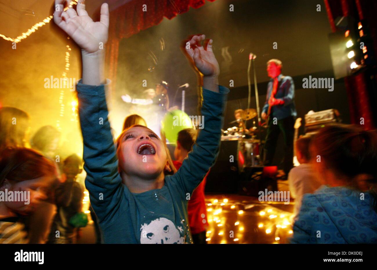 Dec. 30, 2010 - U.S. - NEW YEARS------STAND ALONE-------December 30, 2010 - Maggie Criner (center), 5, joyfully joins the mini-mosh during the 20th annual New Year's at Noon celebration at the Children's Museum of Memphis. Roughly 1,200 people enjoyed romping through the museum with crafts and live music as they rang in the new year. It was the largest attended New Years at noon ce Stock Photo