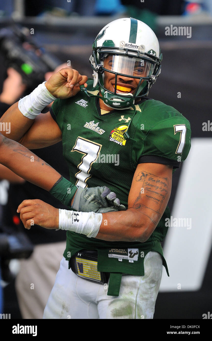 Dec. 31, 2010 - Charlotte, North Carolina, USA - B.J. Daniels (7) is all smiles following his early fourth quarter touchdown.  USF would lead the game 31-13.  The Bulls quarterback was named the Jerry RIchardson Most Valuable Player of the game.  South Florida defeats Clemson 31-26 in the Meineke Car Care Bowl at Bank of America Stadium in Charlotte, North Carolina. (Credit Image:  Stock Photo