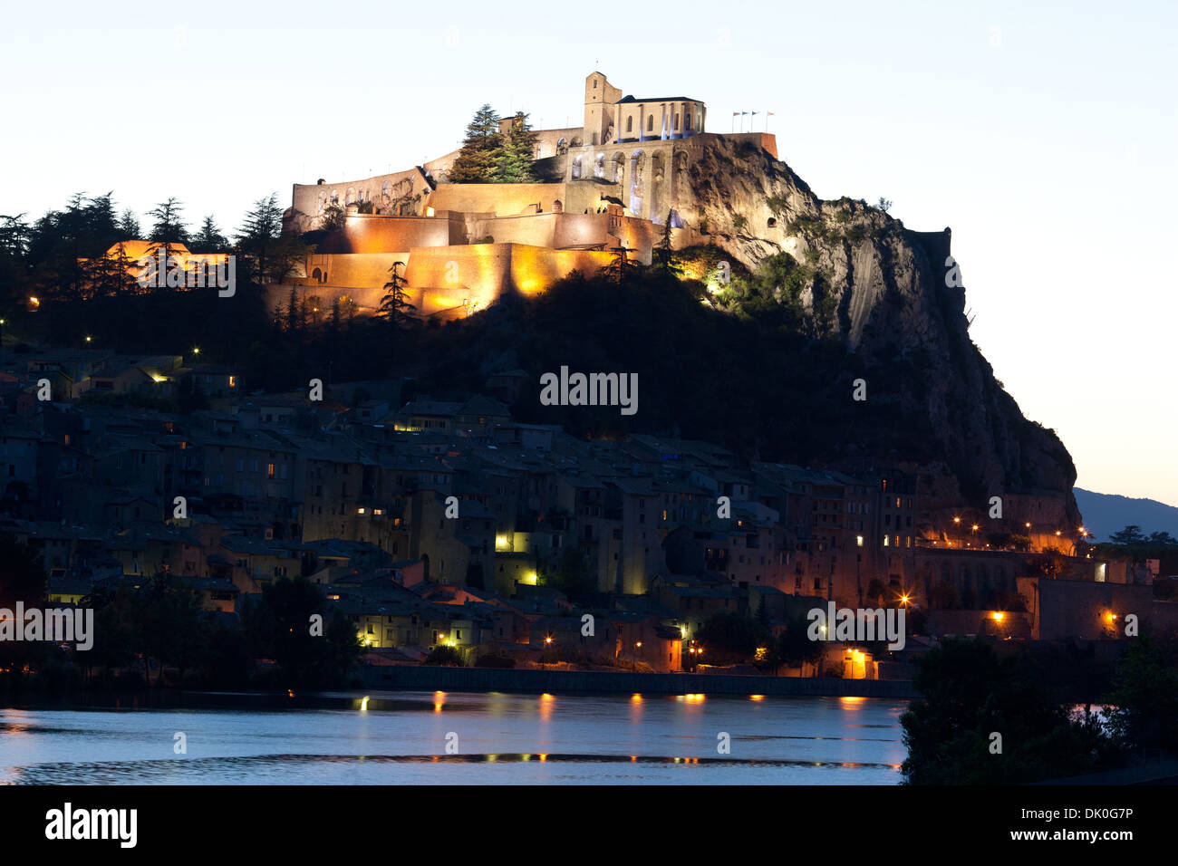 Citadel of Sisteron at dusk overlooking the Old Town and the Durance River. Alpes-de-Haute-Provence, Provence, France. Stock Photo