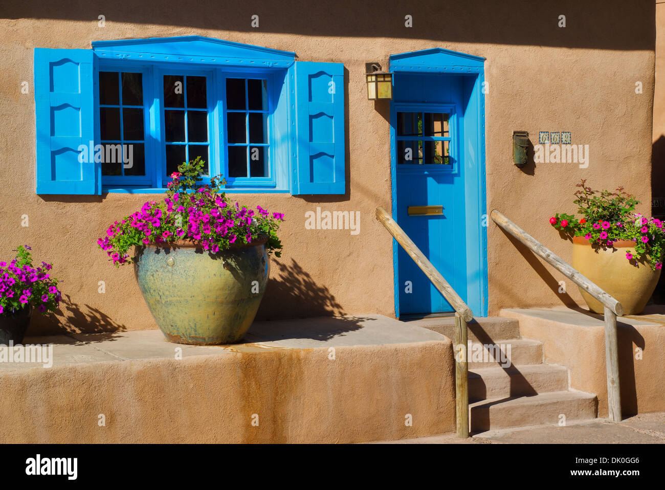 Colorful adobe house with flowers on Canyon Road. Santa Fe, New Mexico Stock Photo