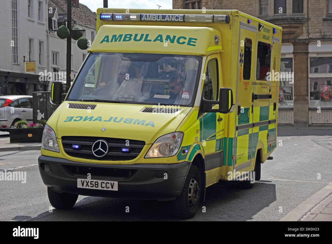 NHS Ambulance on 'blue lights' emergency call Stock Photo