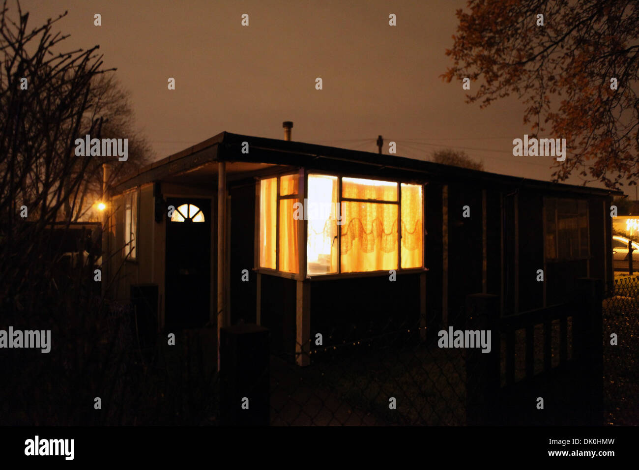 A uni-seco post-war prefab, from 1946, at night on the Excalibur Estate, Catford, Lewisham, London, UK Stock Photo