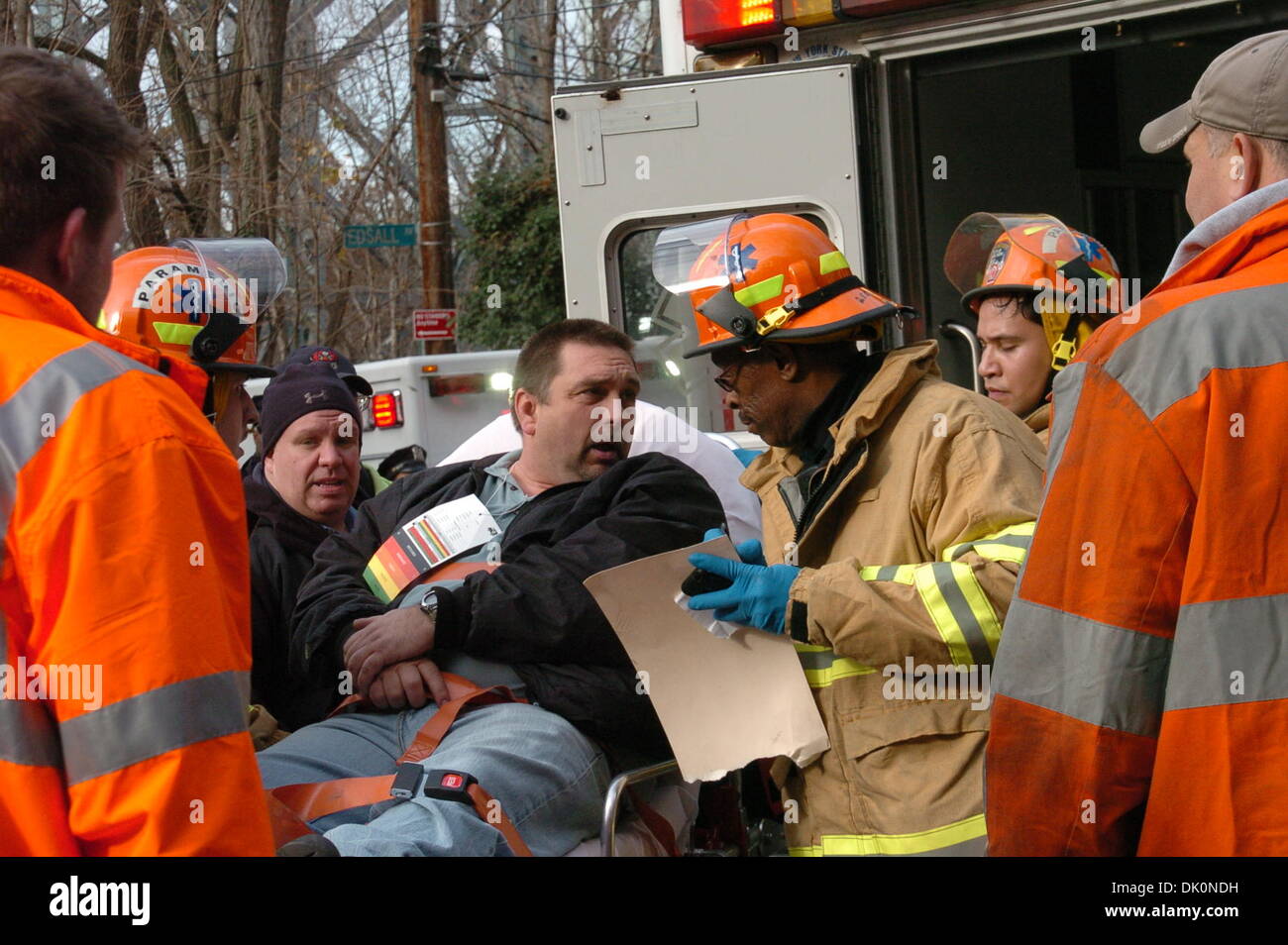 Bronx, New York, USA. 1st Dec 2013.Rescuers transfer an injured man at the site of a train derailment in New York borough of Bronx, on Dec. 1, 2013. At least four people died and 63 injured in the derailment happened before 7:30 a.m. Sunday morning near the Spuyten-Dryvil Station Credit:  Xinhua/Alamy Live News Stock Photo