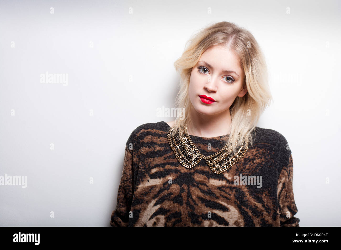 Portrait of a beautiful young fashionable blond woman Stock Photo - Alamy