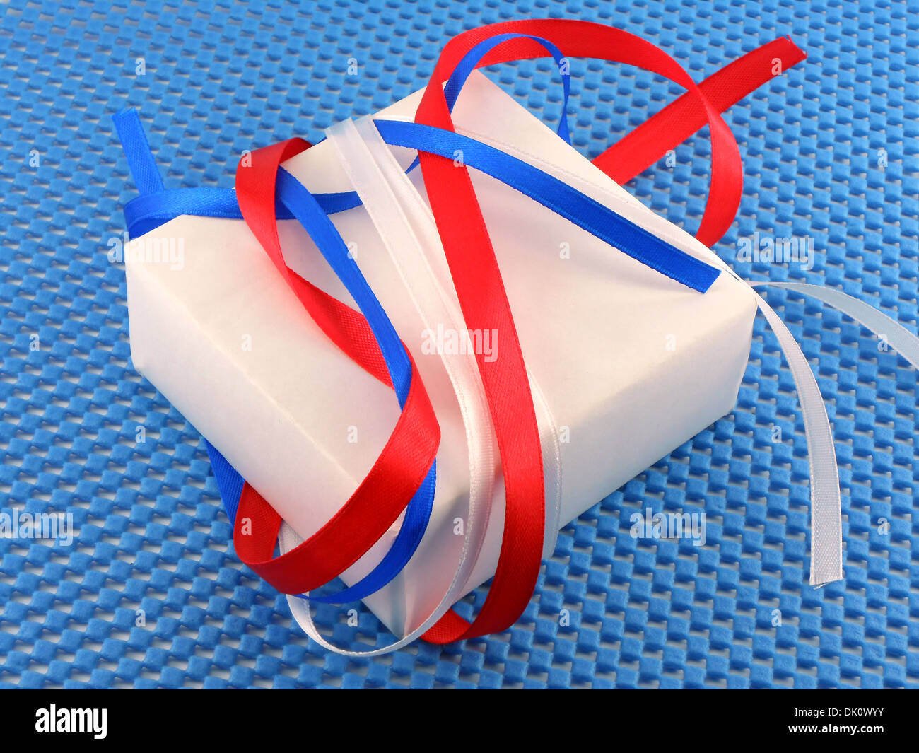 White gift box with red ribbon bow Stock Photo - Alamy