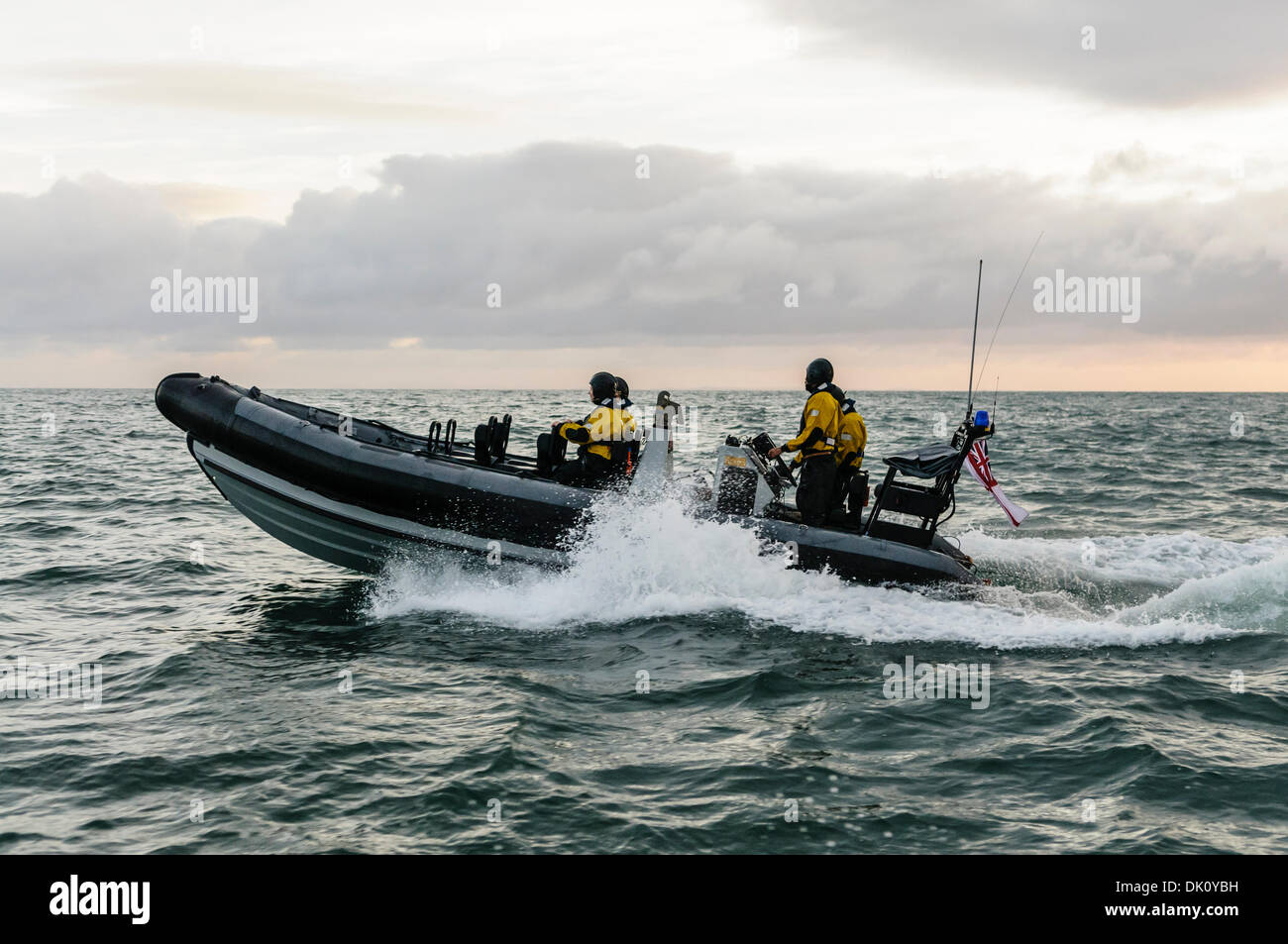 Belfast, Northern Ireland. 30th Nov 2013 - A Royal Navy VT Halmatic Pacific 22 pursuit RIB splashes over waves at speed with four passengers on board wearing dry-suits. Credit:  Stephen Barnes/Alamy Live News Stock Photo