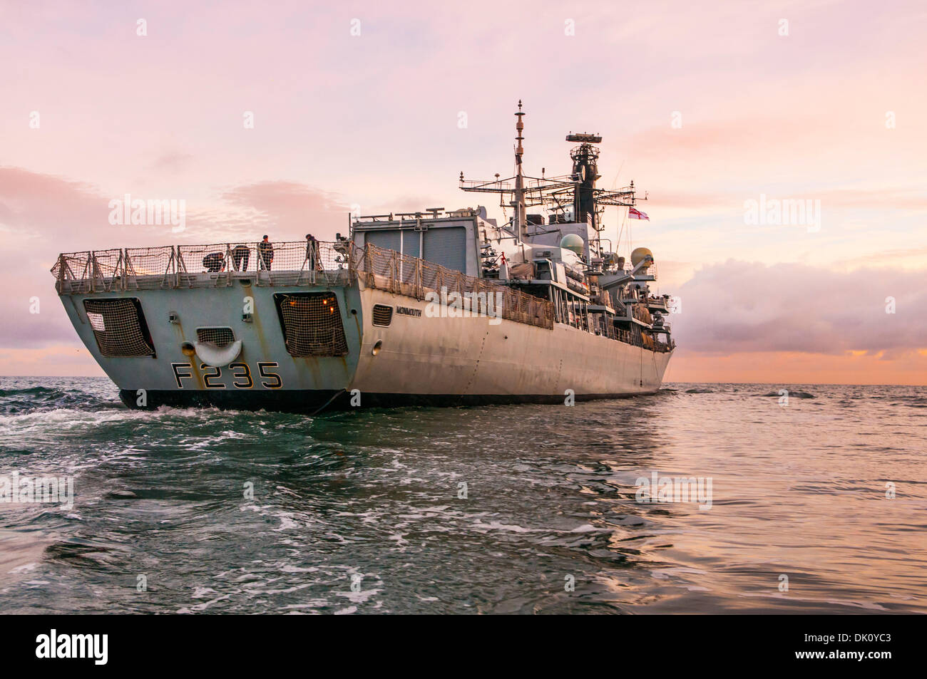 Belfast, Northern Ireland. 30th Nov 2013 - HMS Monmouth, a Royal Navy type 23 Frigate, as it sails into the sunrise Credit:  Stephen Barnes/Alamy Live News Stock Photo