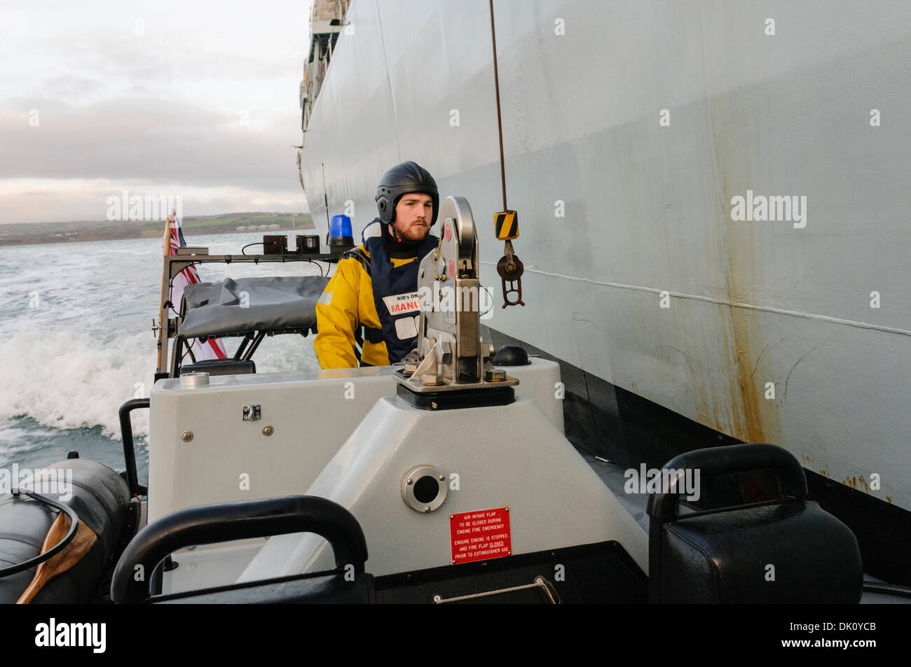 Belfast, Northern Ireland. 30th Nov 2013 - A pursuit RIB from HMS Monmouth pulls up alongside the ship and a winch line is dropped down. Credit:  Stephen Barnes/Alamy Live News Stock Photo