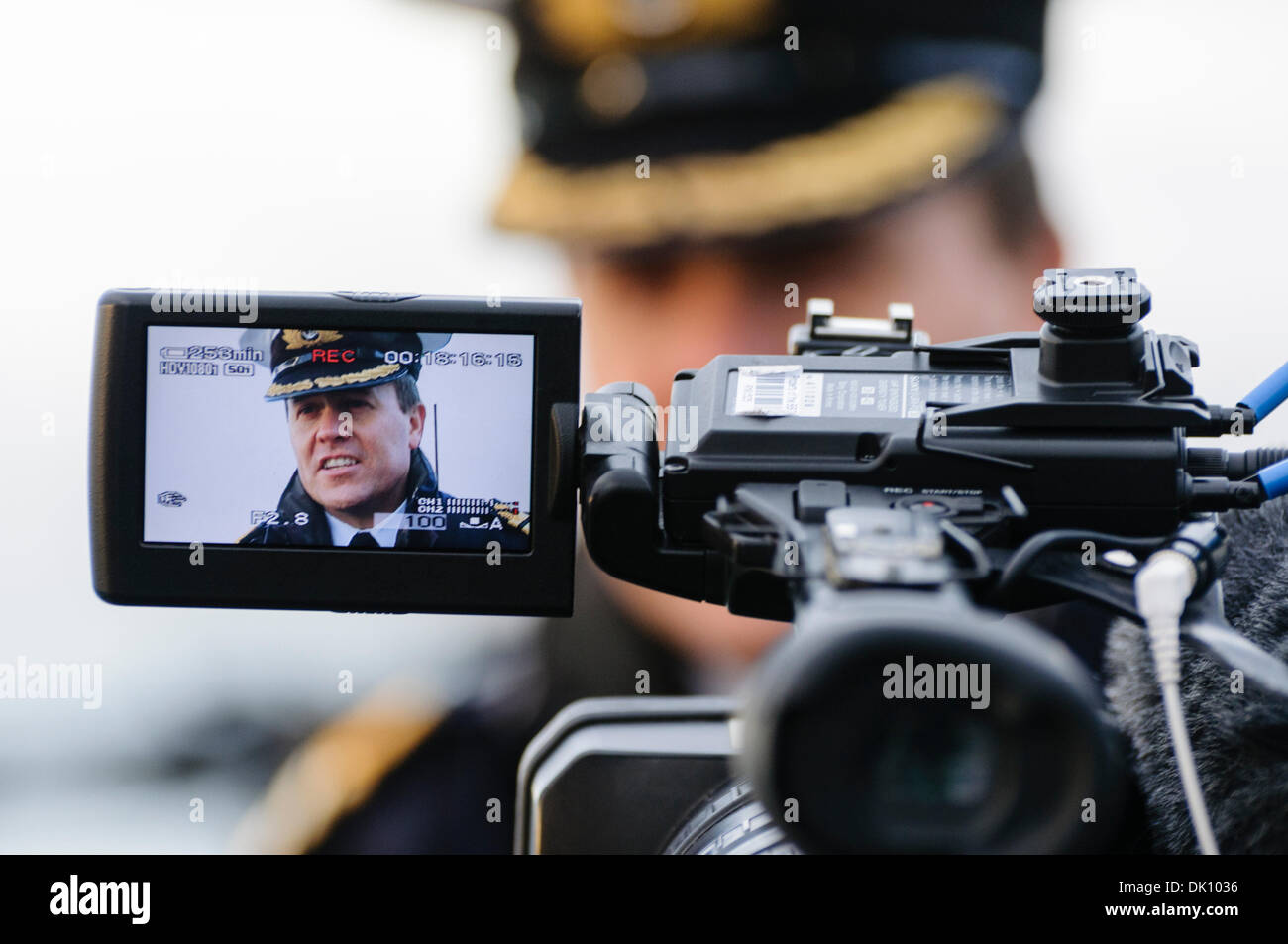 Belfast, Northern Ireland. 30th Nov 2013 - Commander Ruddock of HMS Monmouth, a Royal Navy type 23 Frigate, gives a television interview Credit:  Stephen Barnes/Alamy Live News Stock Photo