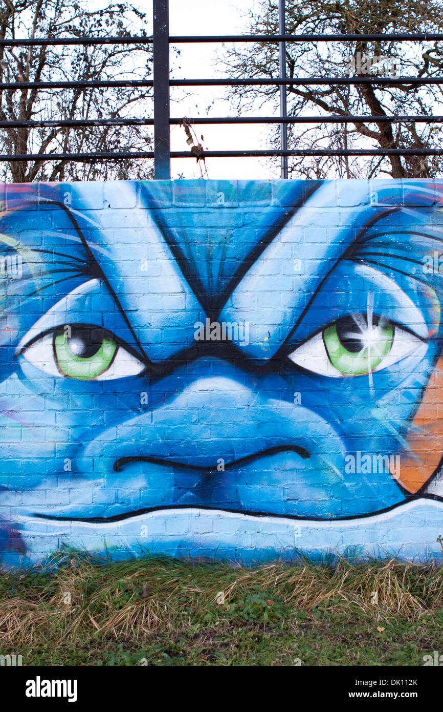 A comical face painted on a wall Stock Photo