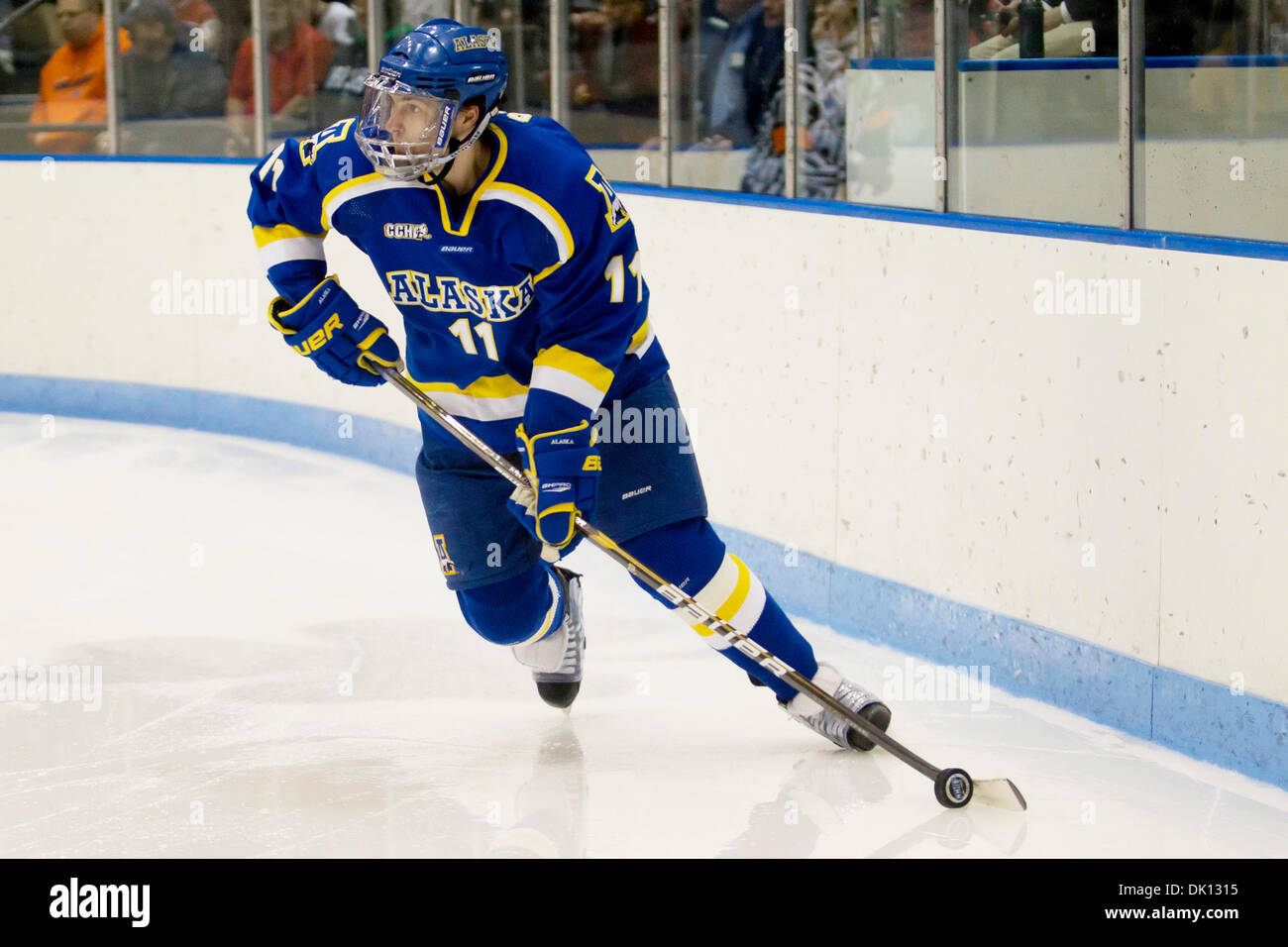 Jan. 14, 2011 - South Bend, Indiana, United States of America - Alaska defensemen Joe Sova (#11) skates with the puck in 2nd period action during NCAA hockey game between Alaska and Notre Dame.  The Notre Dame Fighting Irish defeated the Alaska Nanooks 2-1 in game at Joyce Center in South Bend, Indiana. (Credit Image: © John Mersits/Southcreek Global/ZUMAPRESS.com) Stock Photo