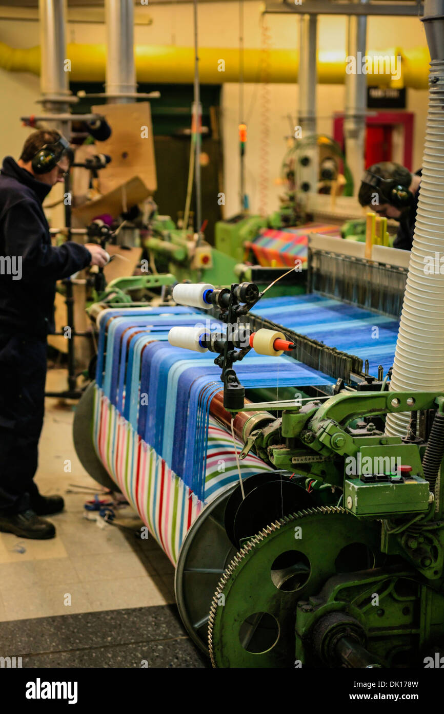 Modern weaving machine producing elaberate patterned textile for the World markets Stock Photo