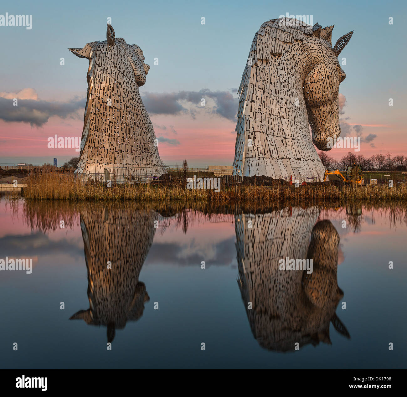 The Kelpies located within the Helix Park in Falkirk, Scotland on a calm sunny day - images taken during/just after sunset Stock Photo