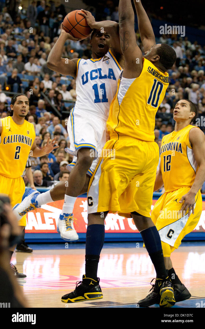 Jan. 20, 2011 - Westwood, California, U.S - UCLA Bruins guard Lazeric Jones #11 (L) drives to the hoop while California Golden Bears center Markhuri Sanders-Frison #10 (R) defends during the NCAA basketball game between the California Golden Bears and the UCLA Bruins at Pauley Pavilion. The Bruins went on to defeat the Golden Bears with a final score of 86-84. (Credit Image: © Bran Stock Photo