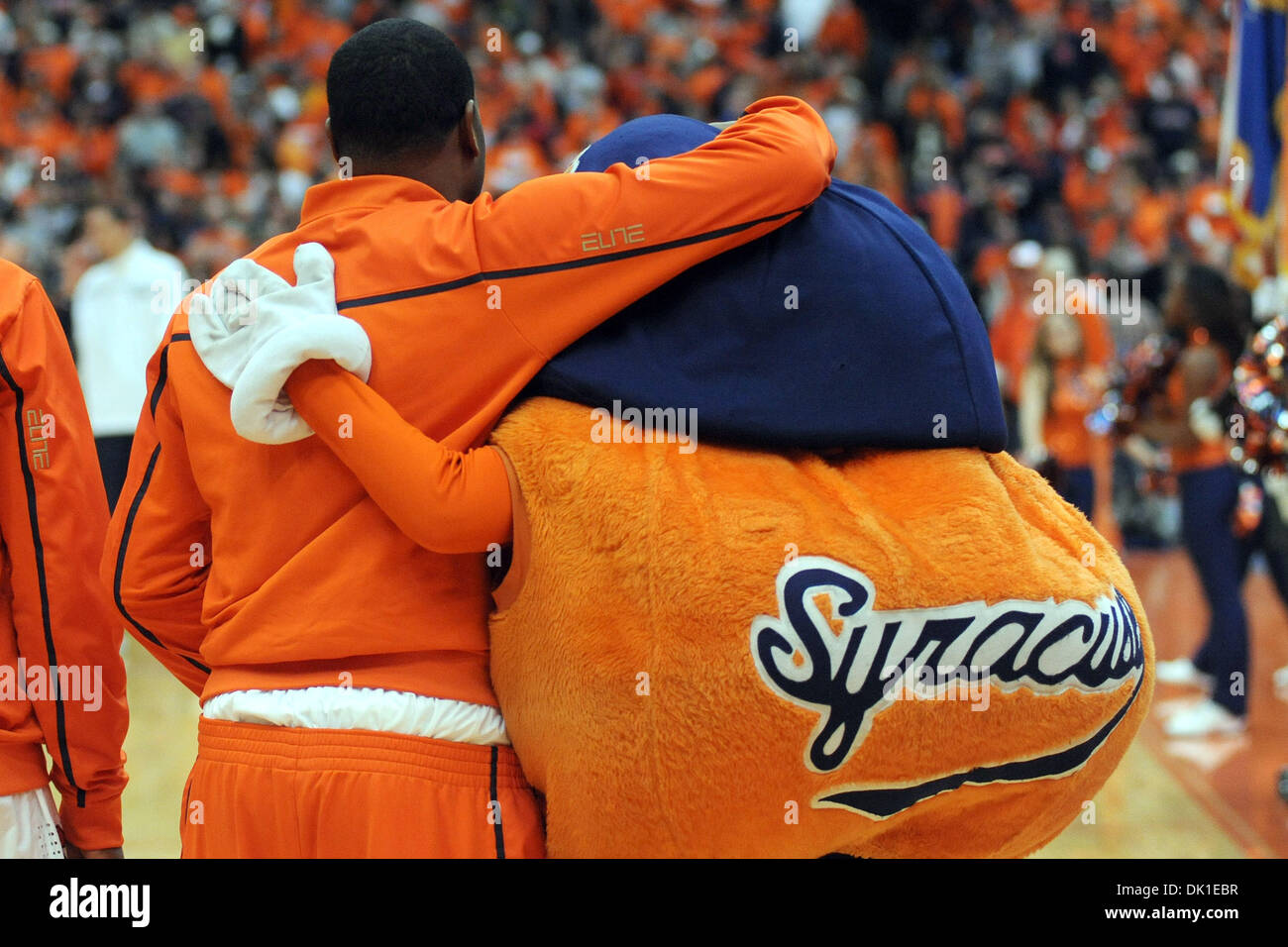 Jan. 22, 2011 - Syracuse, New York, United States of America - Syracuse Orange guard Scoop Jardine (11) gets a hug from mascot Otto during the playing of the national anthem before the start of the game against Villanova. Villanova leads Syracuse 40-29 at the half at the Carrier Dome in Syracuse, NY. (Credit Image: © Michael Johnson/Southcreek Global/ZUMAPRESS.com) Stock Photo