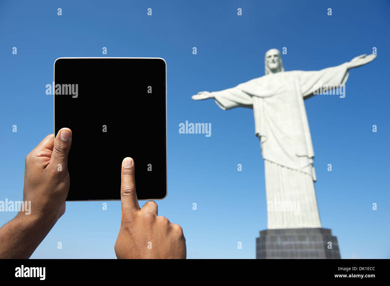 Traveling Brazilian tourist using tablet computer at Corcovado Christ the Redeemer Rio de Janeiro Brazil Stock Photo