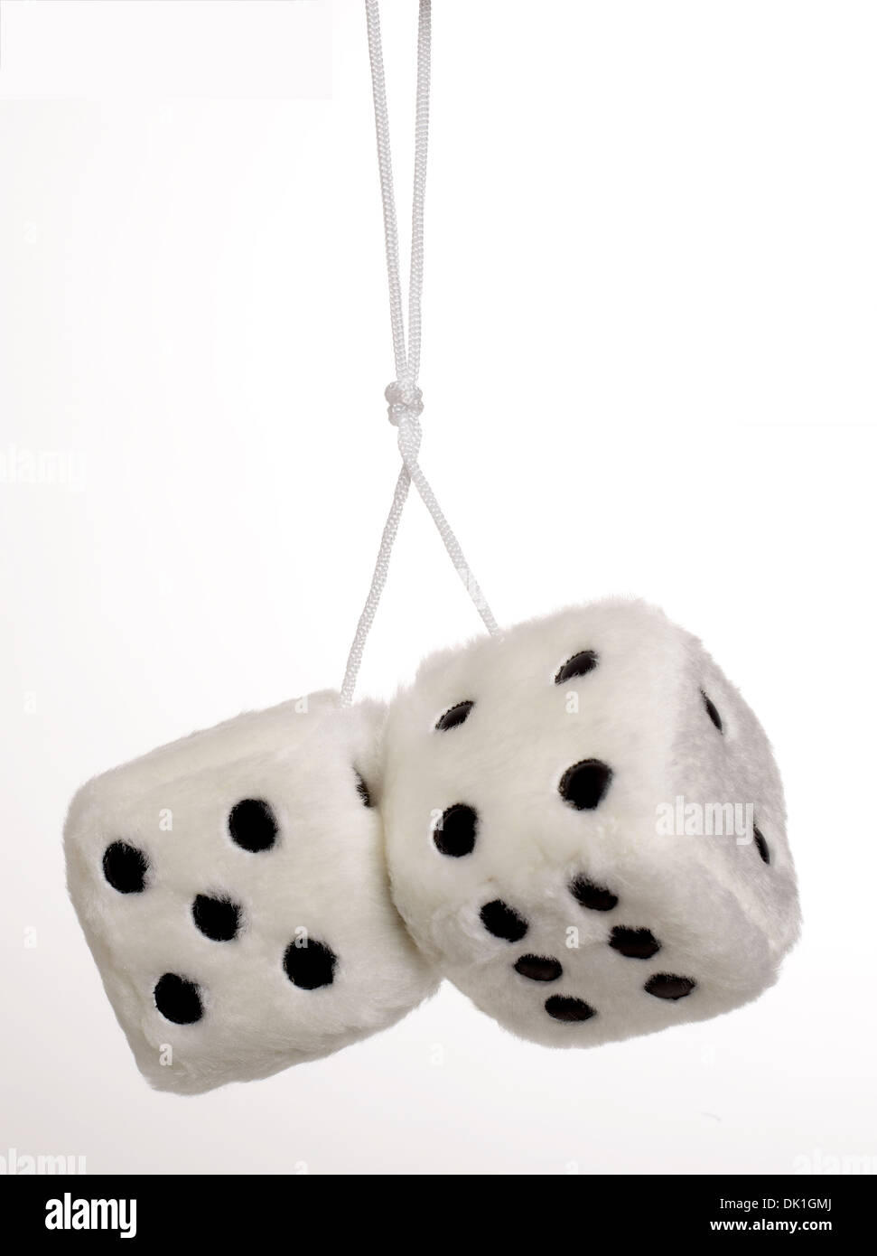 2 oversized White fuzzy dice on white background Stock Photo