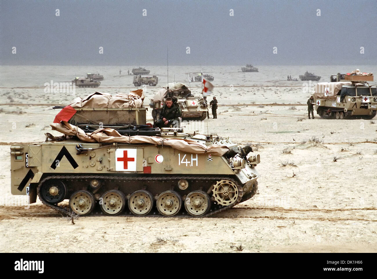 British Army Medical Vehicles of the 7th Brigade Royal Scots, 1st United Kingdom Armored Division, positioned north of the Saudi-Iraq border during Operation Desert Storm February 28, 1991 in Iraq. In the foreground is a British FV-432 armored personnel carrier. Stock Photo
