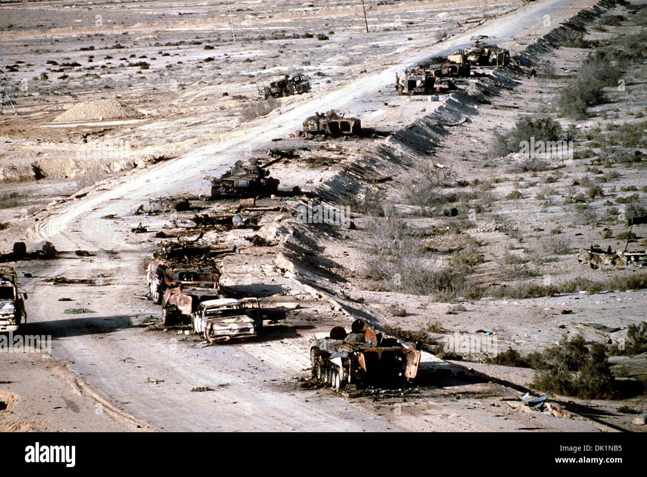 Aerial view of demolished Iraqi military vehicles destroyed by coalition forces along a roadway in the Euphrates River Valley in the aftermath of Operation Desert Storm March 4, 1991 in Iraq. Stock Photo