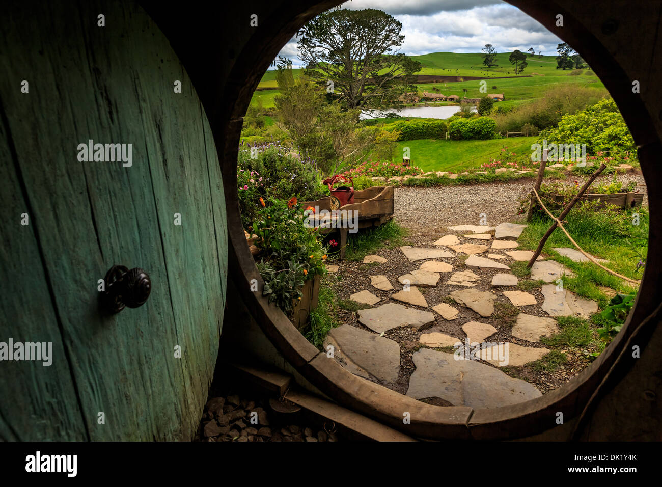 Looking out of a Hobbit-hole in Hobbiton, location The Hobbit film trilogy, Hinuera, Matamata, New Zealand Stock Photo