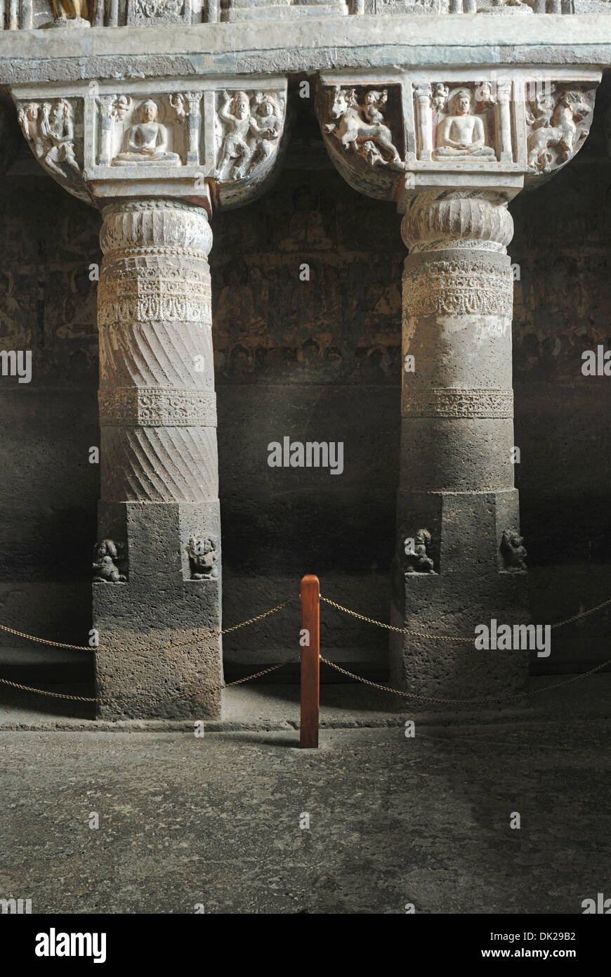Cave 19: Two Pillars with details. Shows seated Buddha figure in Padmasana. Ajanta Caves, Aurangabad, Maharashtra, India Stock Photo