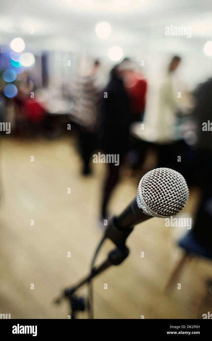 Open mic nite microphone and blurred people Stock Photo
