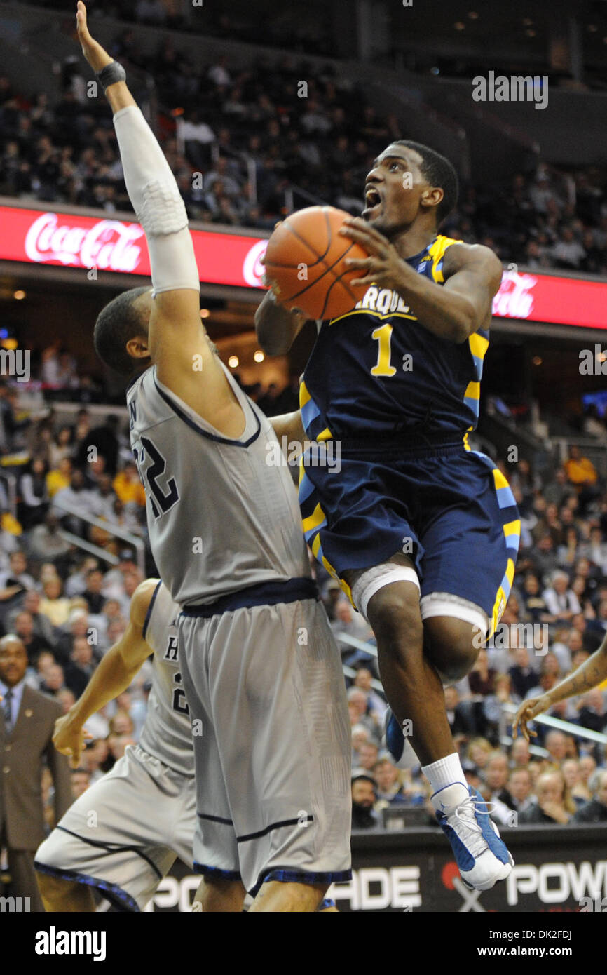 Feb. 13, 2011 - Washington, District of Columbia, United States of America - Marquette Golden Eagles guard Darius Johnson-Odom (1) attempts a shot in front of Georgetown Hoyas forward Julian Vaughn (22) during the first half at Verizon Center. At half time the Marquette Golden Eagles are leading Georgetown Hoyas 35-31. (Credit Image: © Carlos Suanes/Southcreek Global/ZUMAPRESS.com) Stock Photo