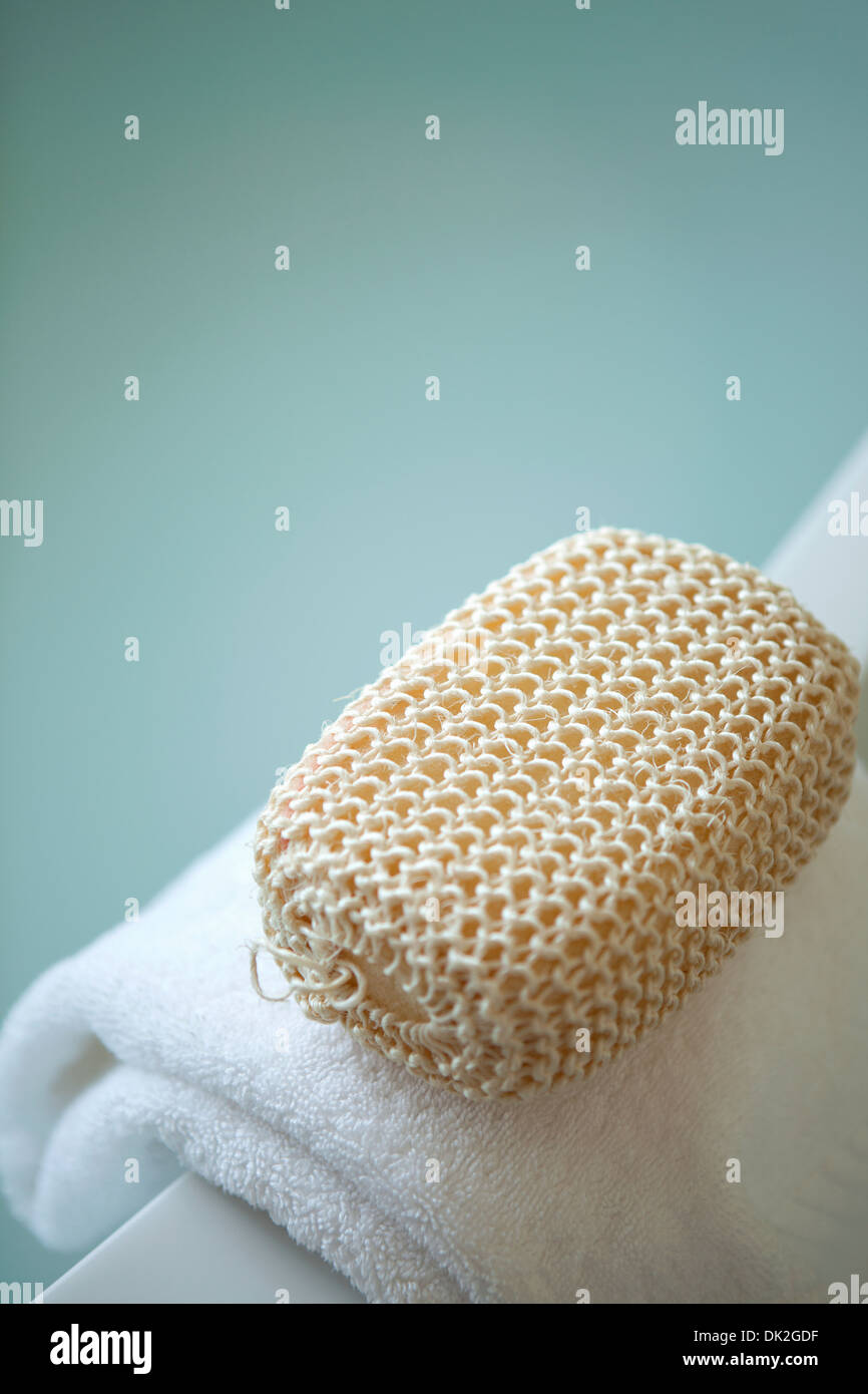 Close up high angle view of spa loofah on towel Stock Photo