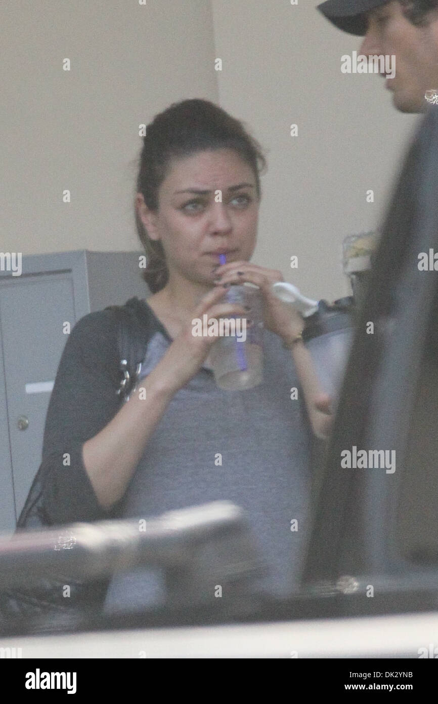 Mila Kunis wears no makeup as she leaves gym with her trainer and gets her nails in West Hollywood Los Angeles Stock Photo - Alamy