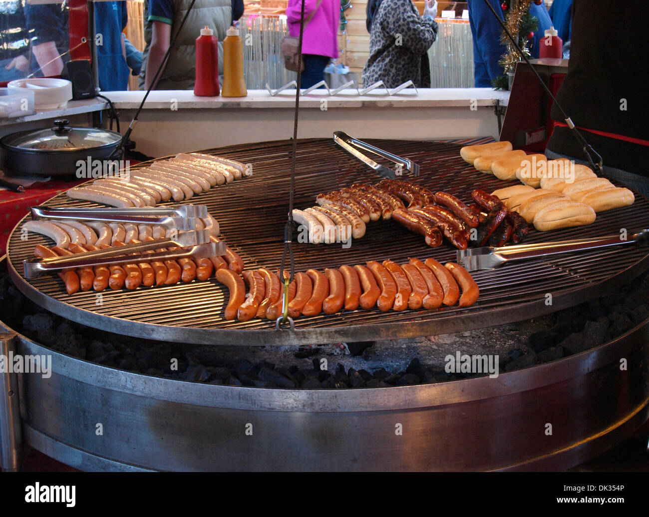 German sausages being cooked on commercial charcoal grill, Devon, UK Stock Photo Alamy