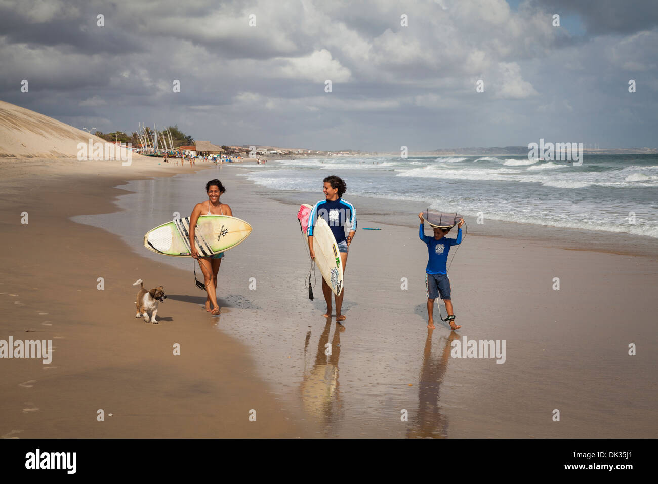 Surfers on the beach in Iguape, Fortaleza district, Brazil. Stock Photo