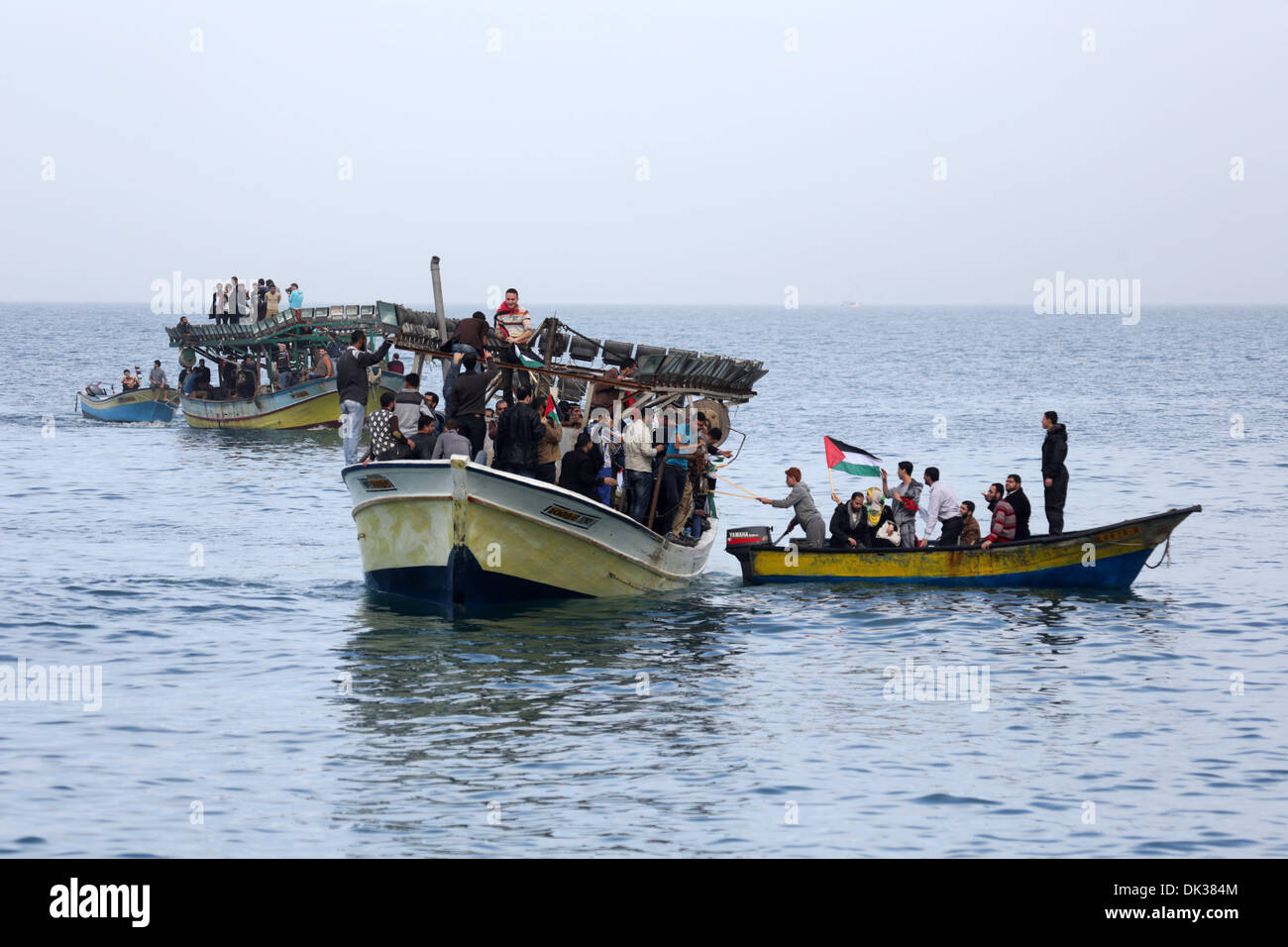 Gaza. 2nd Dec, 2013. Palestinians sail their boats as part of a convoy which launched at the initiative of the 'Intifada Youth Coalition' to break the naval blockade of Gaza as a protest against the Israeli siege in Gaza port on Dec. 2, 2013. Credit: Xinhua/Wissam Nassar/Alamy Live News Stock Photo